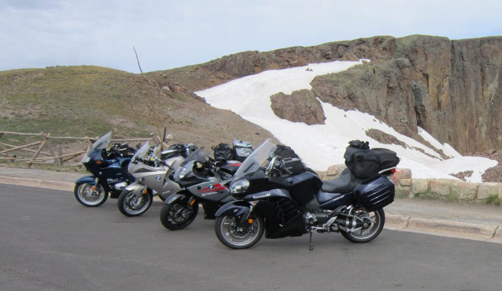 Sport touring motorcycles and glacial snow at the summit of the Rocky Mountain Highway in Rocky Mountain National Park