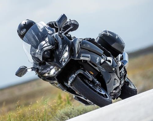 Silver Yamaha FJR 1300 taking a corner on a rural road