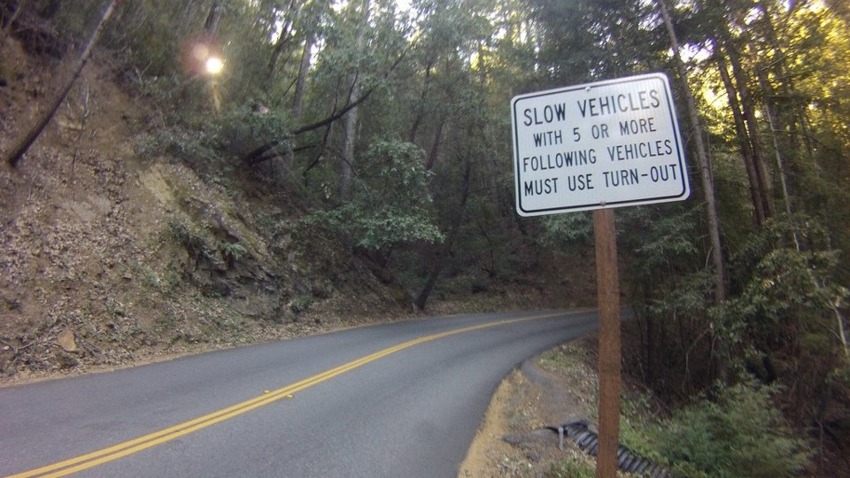 a corner on a narrow country road with limited visibility