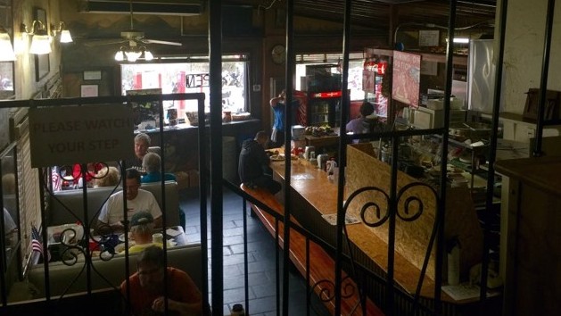 Inside The Rock Store guests find rustic 1960's style booths and a lunch counter 