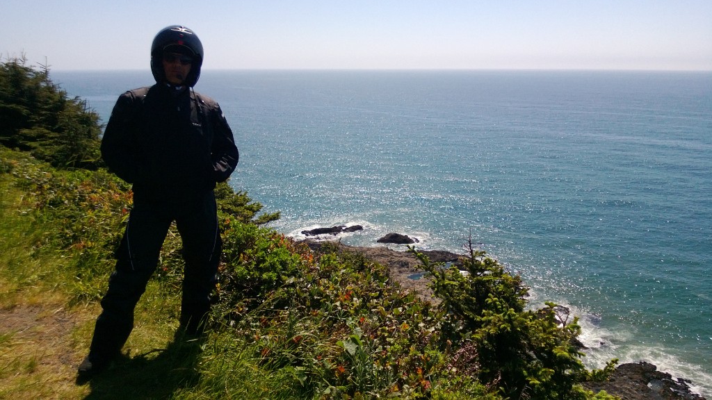 Rider overlooking a pristine Pacific ocean along California Highway 1