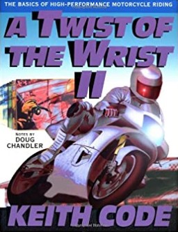 An illustrated sportbike leaning into a corner on the cover of A Twist of the Wrist II