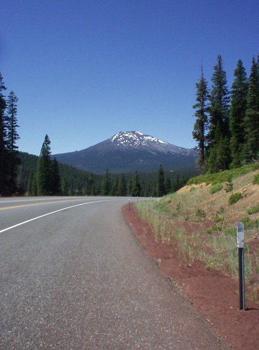 Mount Bachelor still covered with a few patches of snow rises the distance off Cascade Lakes National Scenic Byway     