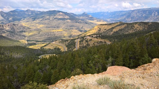 The hills and trees take vivid pastel colors across the valley below Dead Indian Pass on Chief Joseph Highway 