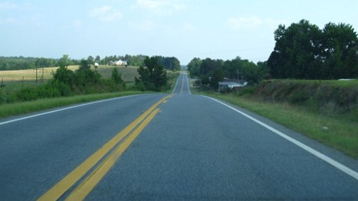 Two-lane road stretching into the distance.
