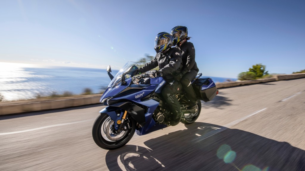 Two-up riding a GSX-S1000GT along the ocean