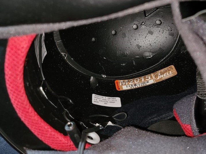 Snell helmet certification sticker and date of manufacture.