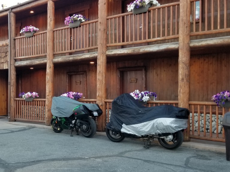 Two covered motorcycles.