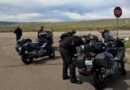 Motorcycle riders stopped on side of road