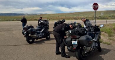 Motorcycle riders stopped on side of road