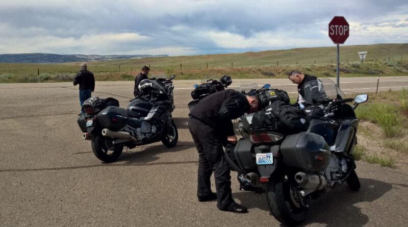 Motorcycle riders stopped on side of road