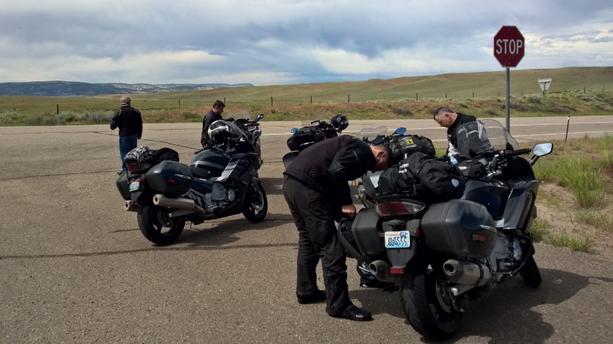 Motorcycle riders stopped on side of road