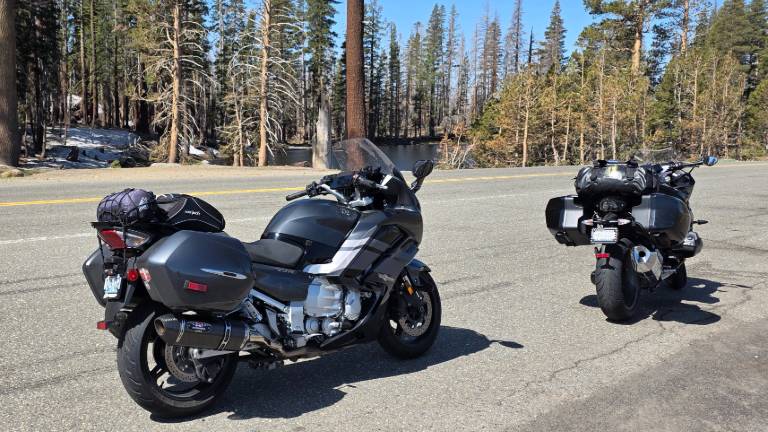 Sport touring motorcycles neat alpine lake on CA Hwy 88
