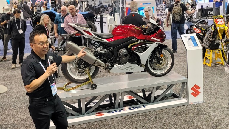 Suzuki product manager unveiling the 2027 GSX-R1000R 40th Anniversary model.