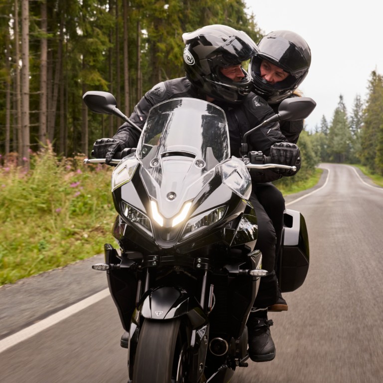 Triumph Tiger Sport 800 Tour on the road with rider and pillion