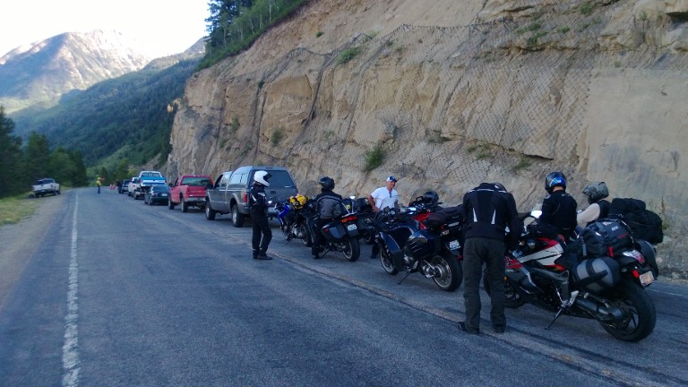 Sport touring riders stopped at a road construction site