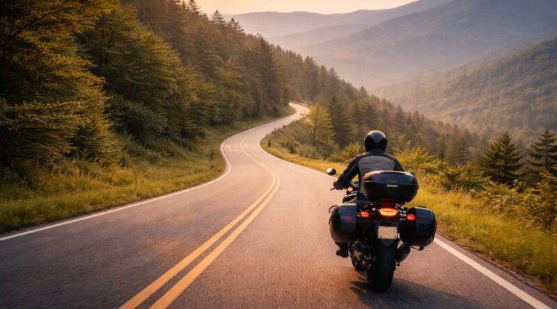 Solo-rider heading into a new day on a curving road