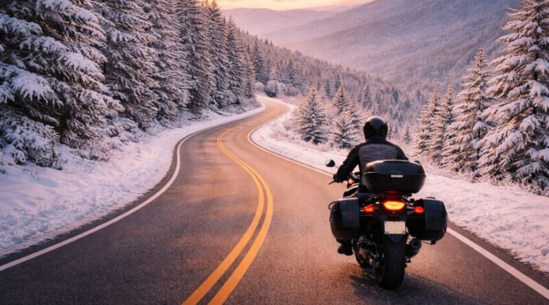 A lone rider on a snowy mountain road.