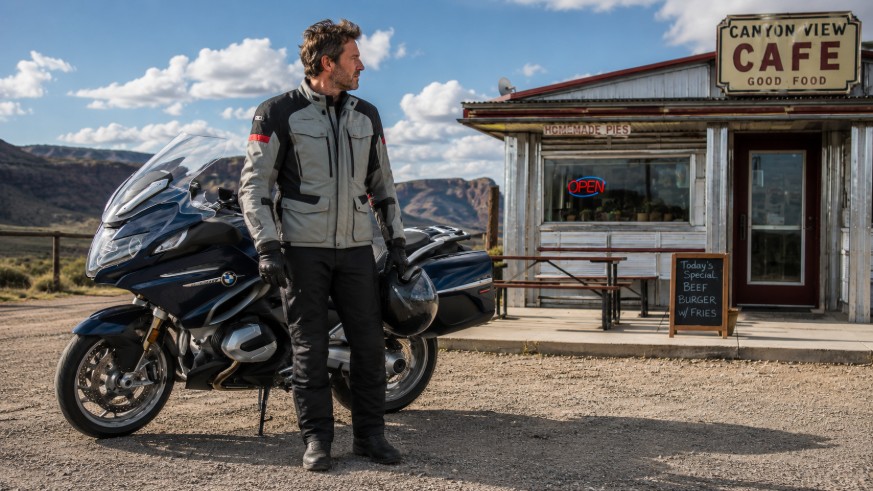 Sport touring rider parked outside a roadside diner