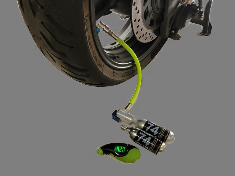 Maximus tire inflator set-up connected to rear tire